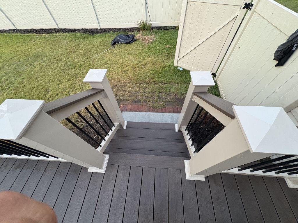 Aerial view of composite deck center staircase with black balusters