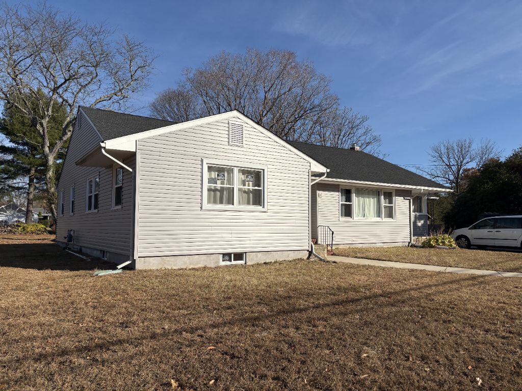 Light gray siding on single-story home — side elevation