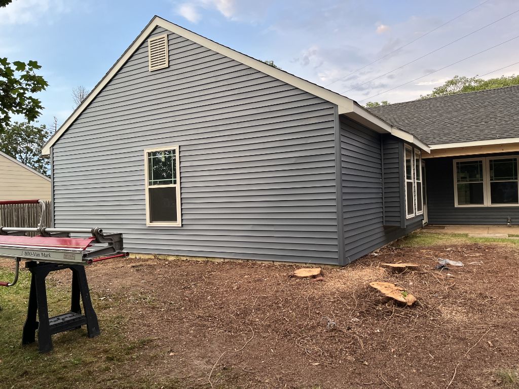 Charcoal gray siding on rear of ranch home