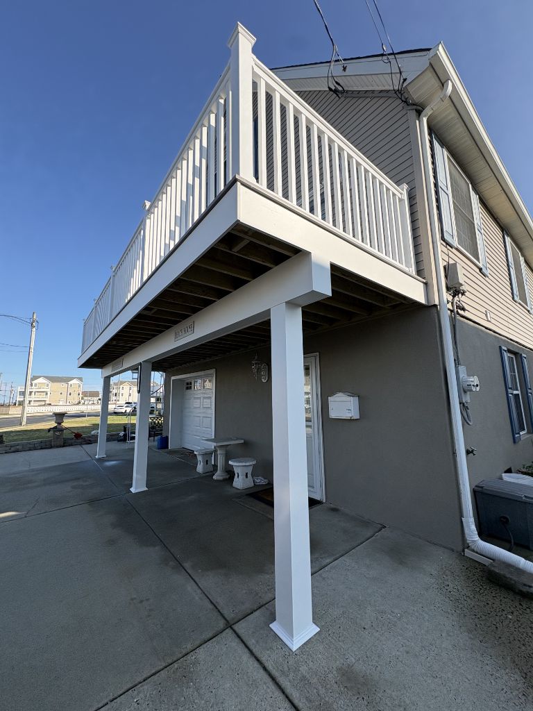 Elevated composite deck with white railing on beach house — Wildwood NJ