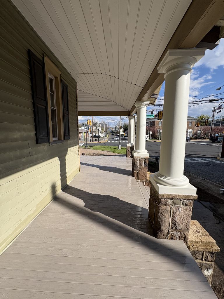 Composite front porch with decorative stone columns