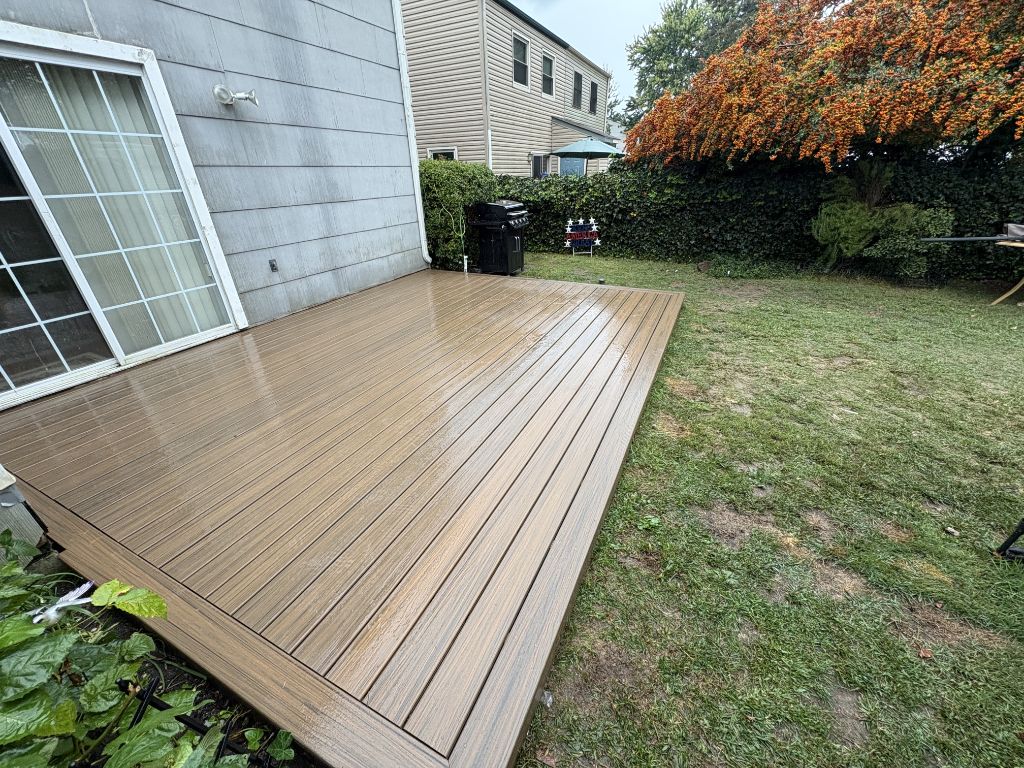 Ground-level composite deck with warm brown boards
