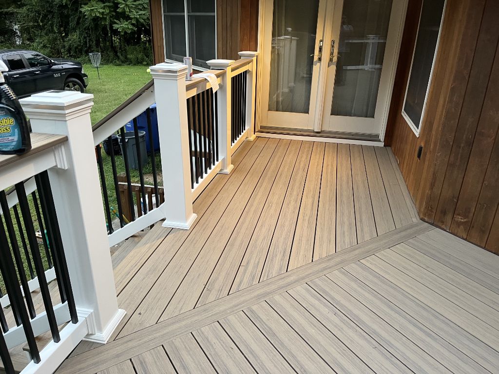 Composite deck with angled board pattern and white railing