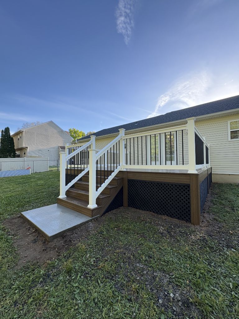 Composite deck with side staircase and lattice skirting