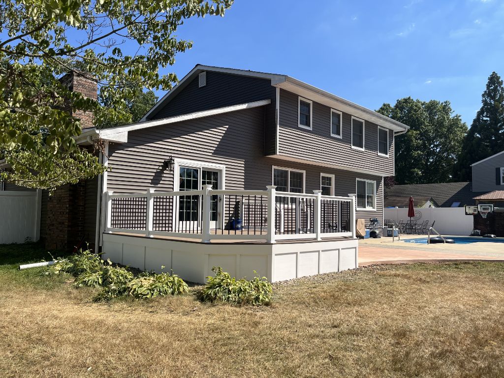 Brand new deck with white railing built to replace an old structure — South Jersey